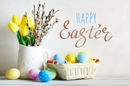 Happy Easter title on photo of flowers, flower pot, and eggs in basket