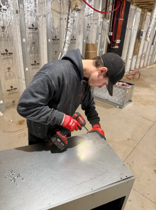 Photo of technician working on new construction hvac