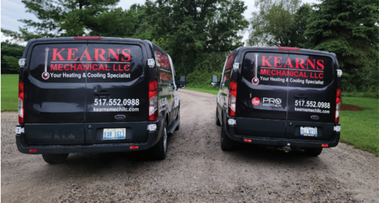 The backs of two Kearns Mechanical trucks