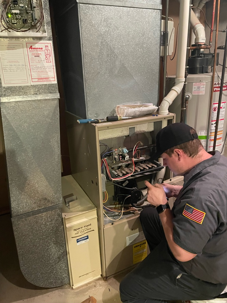Photo of technician, David, working on a furnace