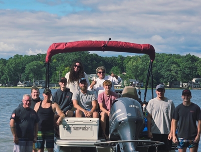Kearns Mechanical team on a pontoon boat